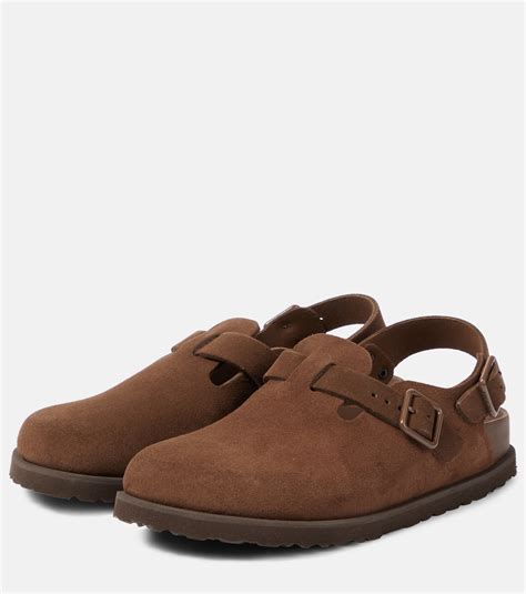 Tokio suede mules in brown .